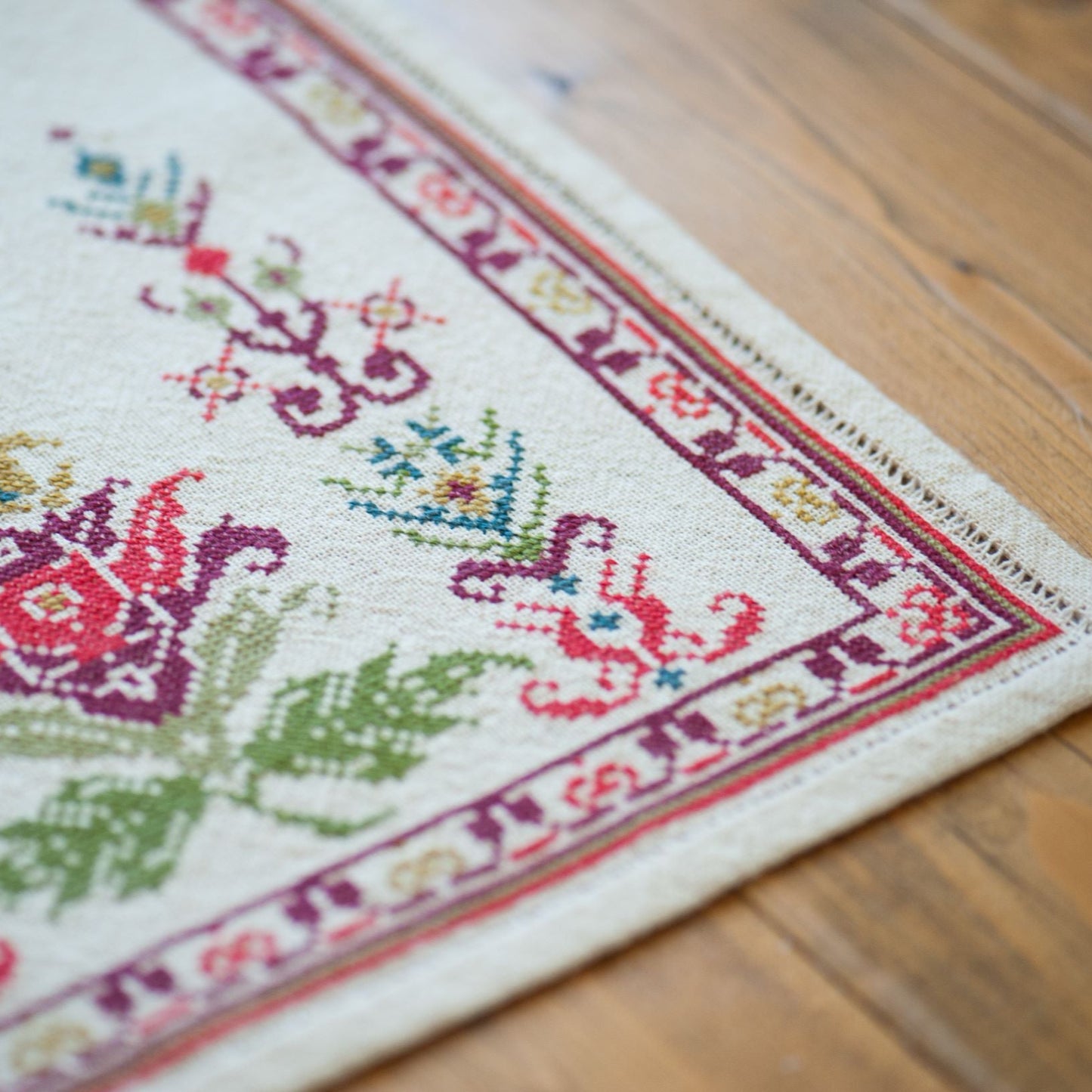 folk embroidery table runner with floral design