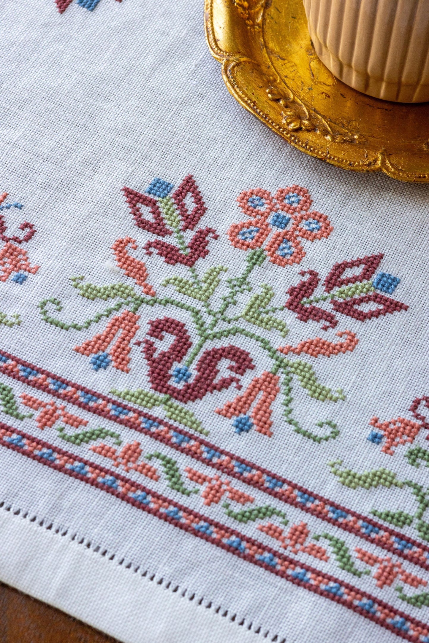 folk embroidery with pink floral design