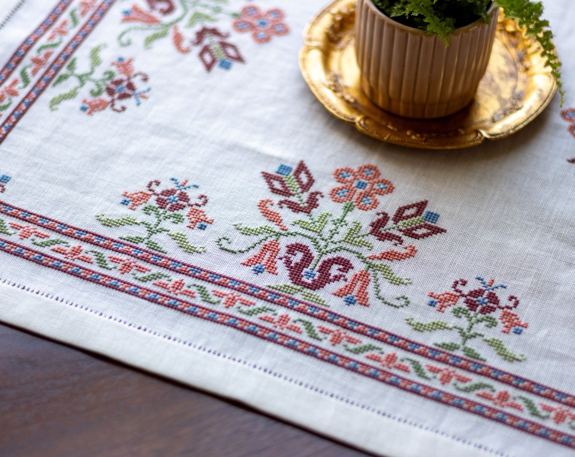 folk embroidery with pink floral design