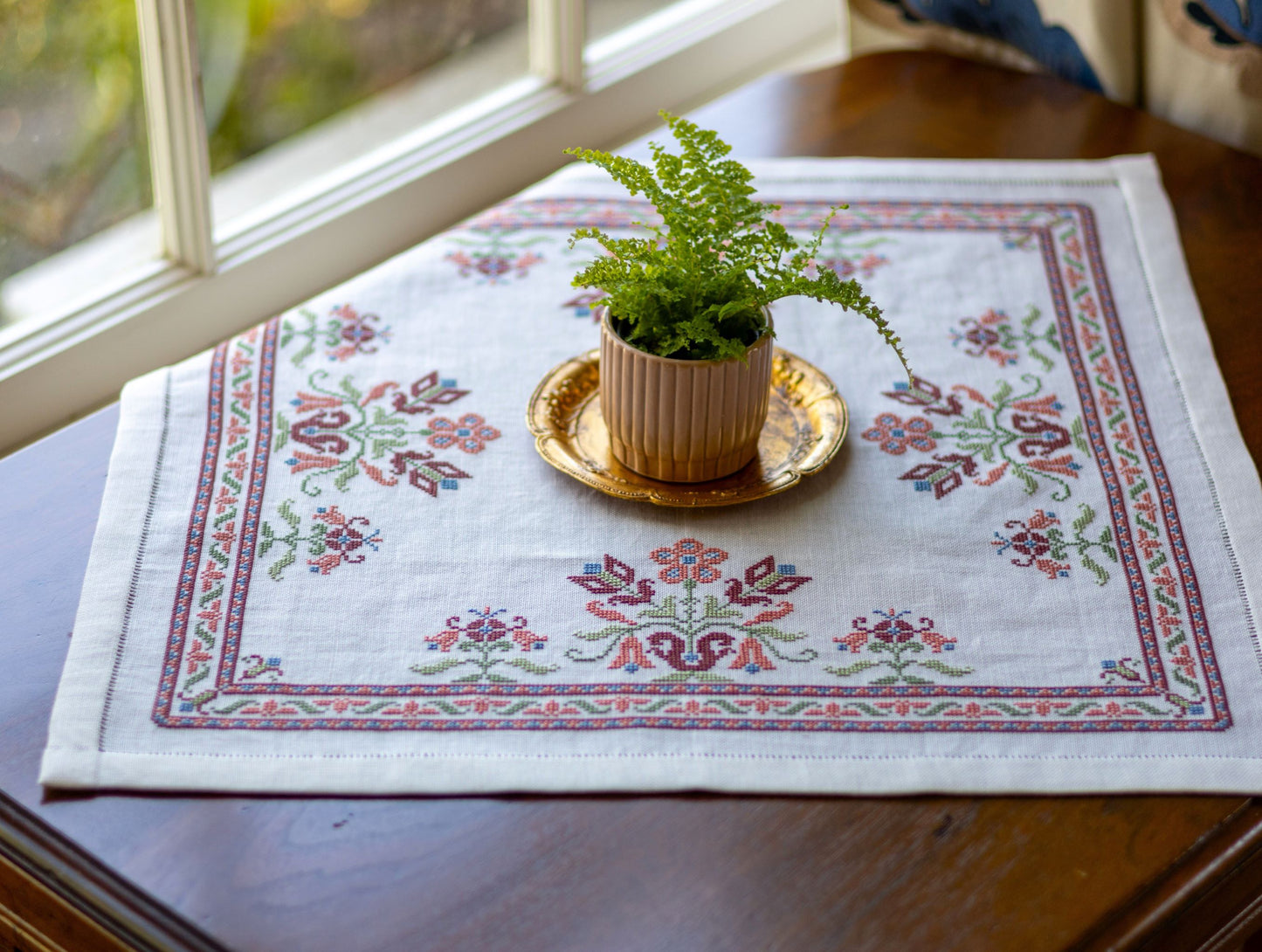 folk embroidery with pink floral design