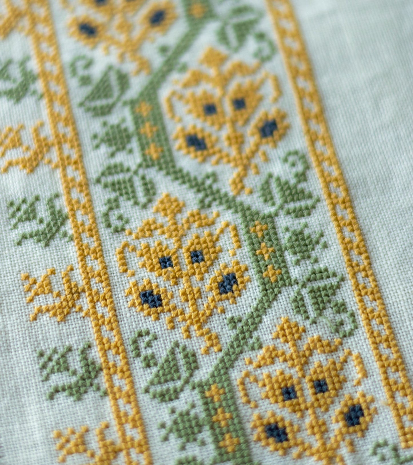 folk embroidery table linen with yellow and green floral design