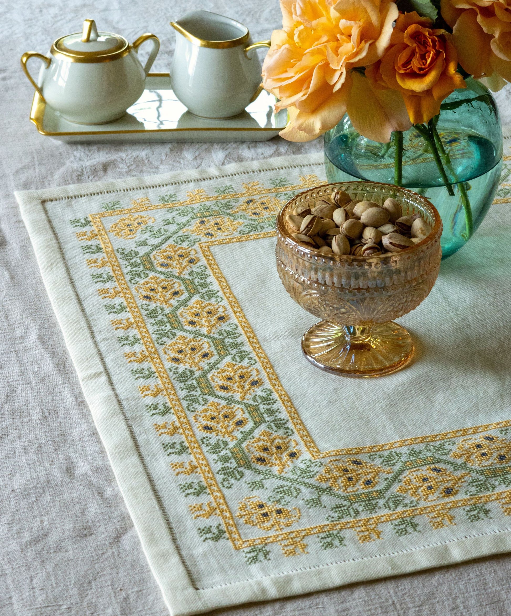 folk embroidery table linen with yellow and green floral design