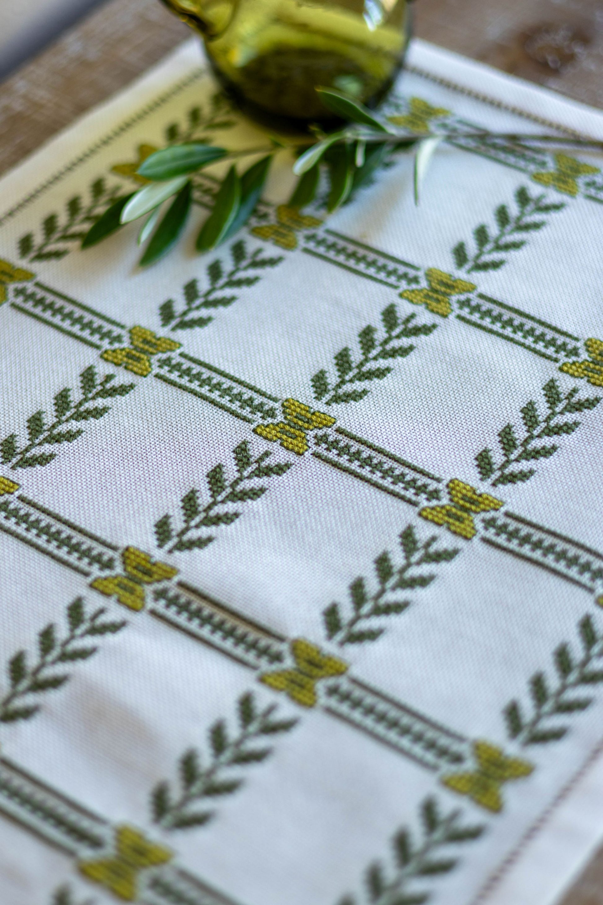 cross stitch folk embroidery with olive branch design