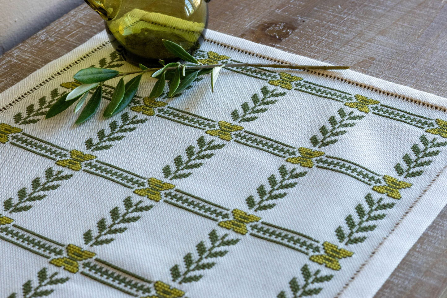 cross stitch folk embroidery with olive branch design