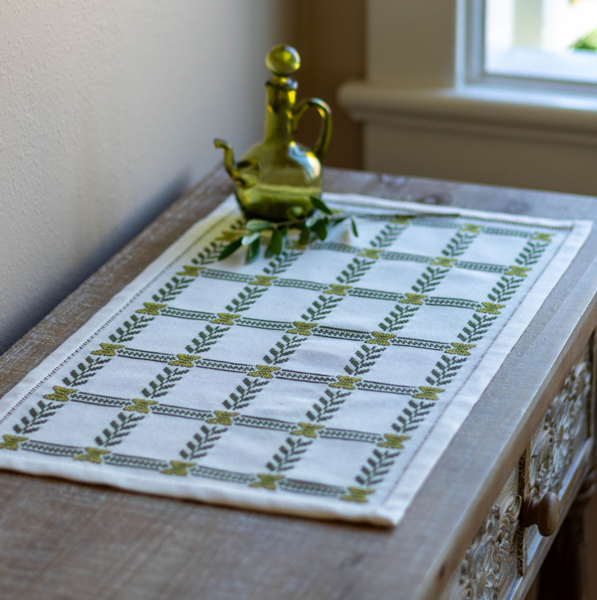 folk embroidery with olive branch design on table 