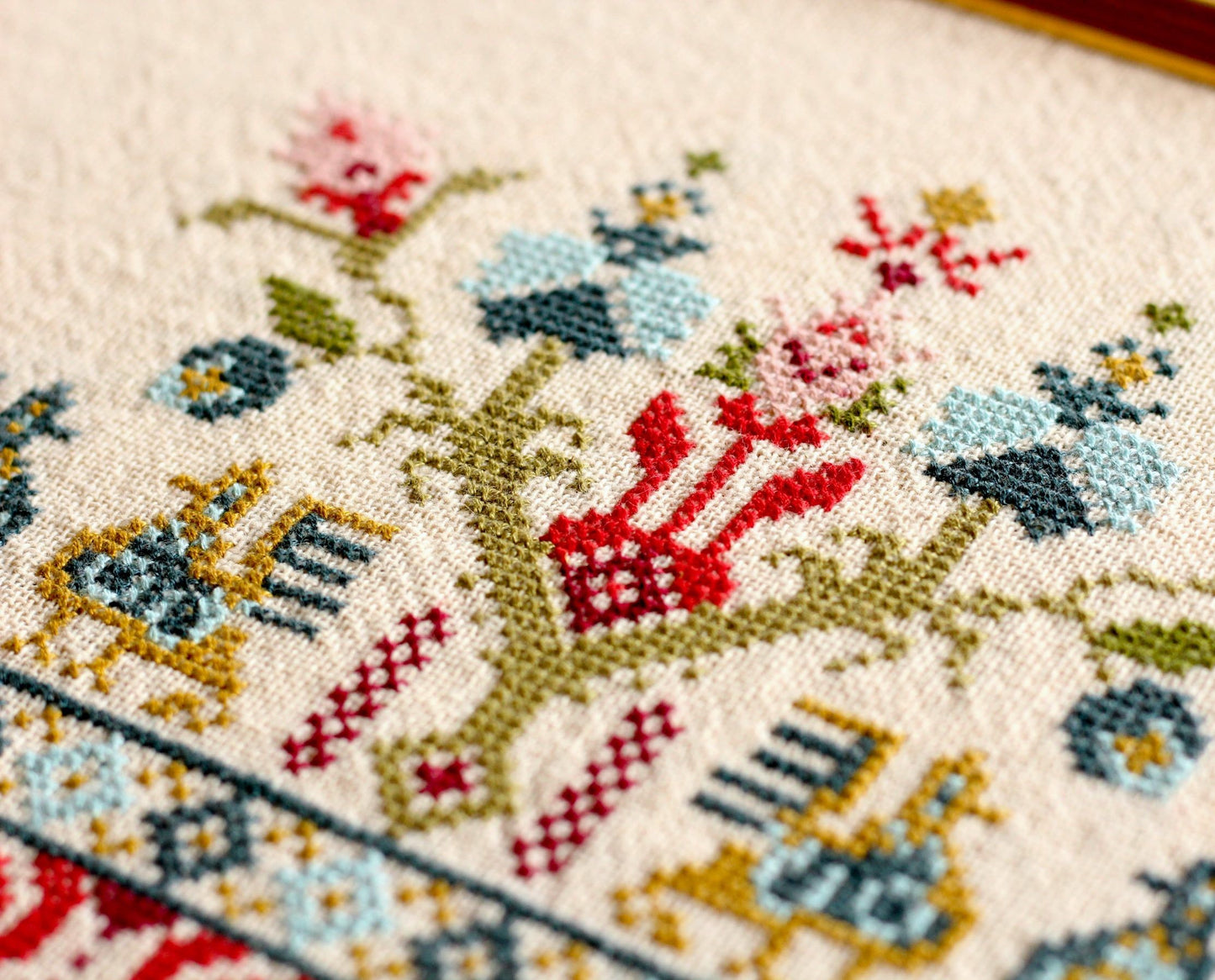 cross stitch folk embroidery with bird design