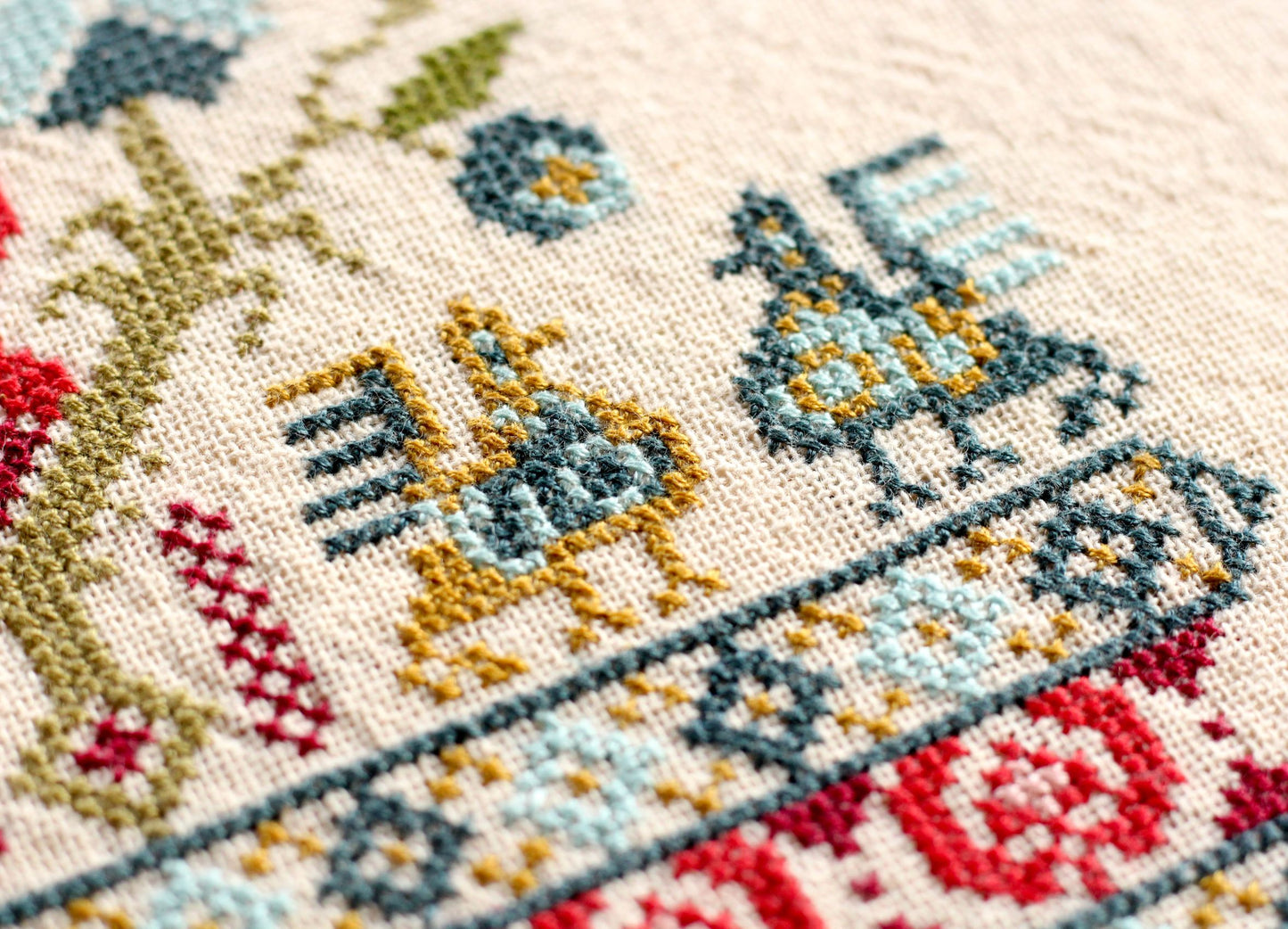 cross stitch folk embroidery with bird design