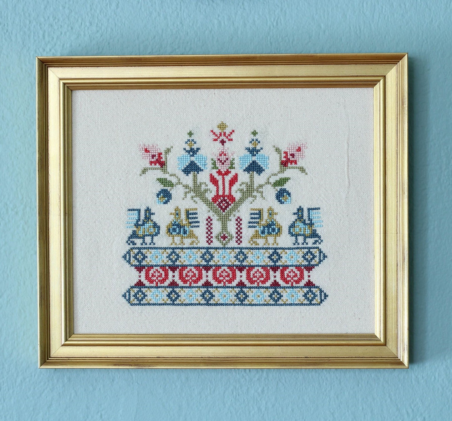 cross stitch folk embroidery with bird design