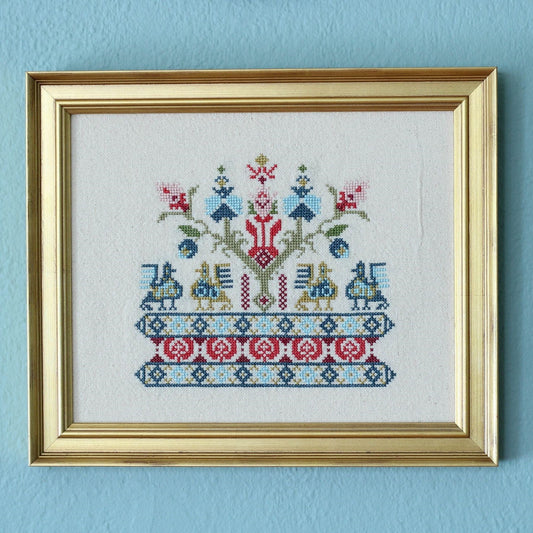 cross stitch folk embroidery with bird design