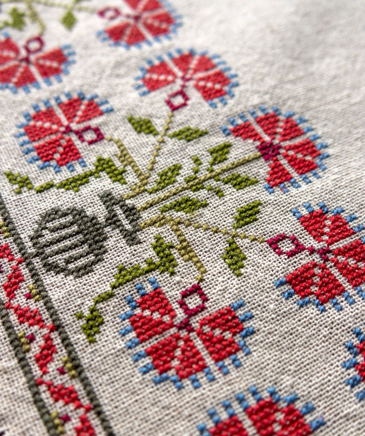 cross stitch folk embroidery with red poppy design