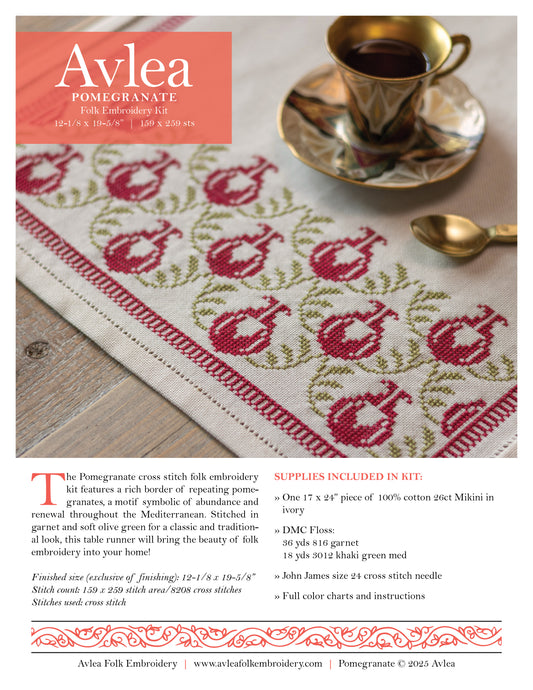 Avlea Folk Embroidery Pomegranate table runner with cross-stitch pattern on a wooden surface.