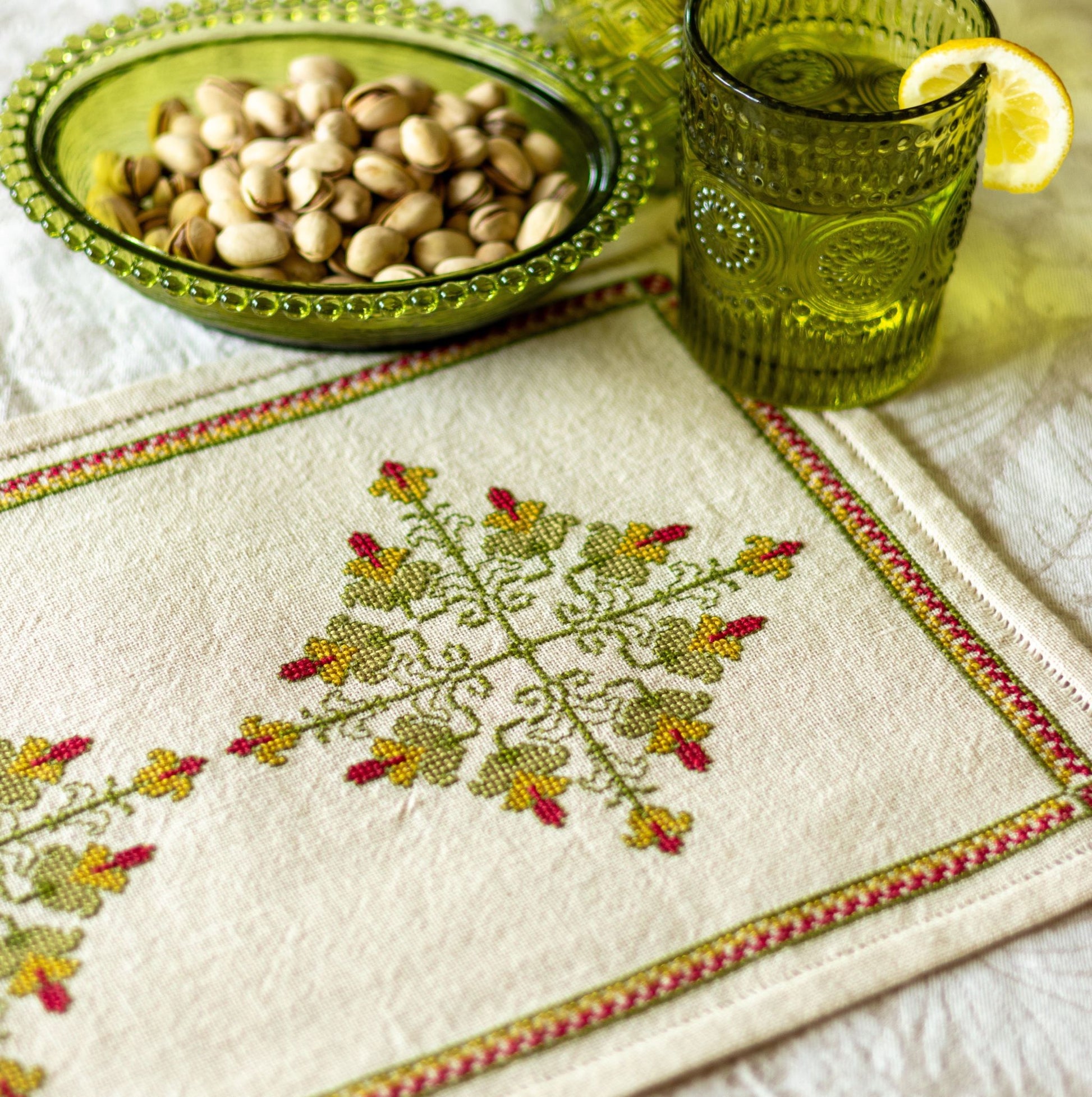 cross stitch folk embroidery design in green and red