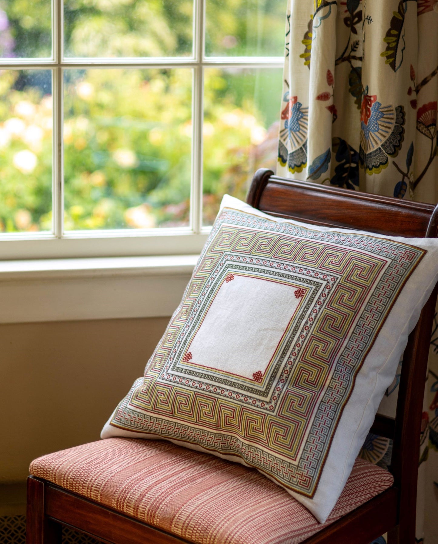 folk embroidery cushion with meander design