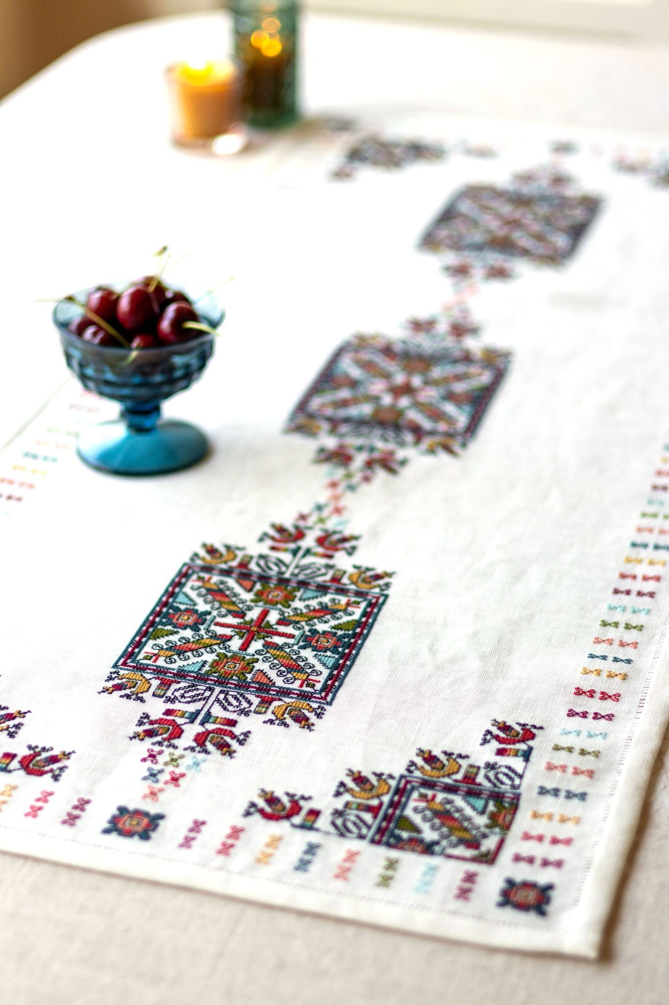 folk embroidery with geometric square design in multi colors