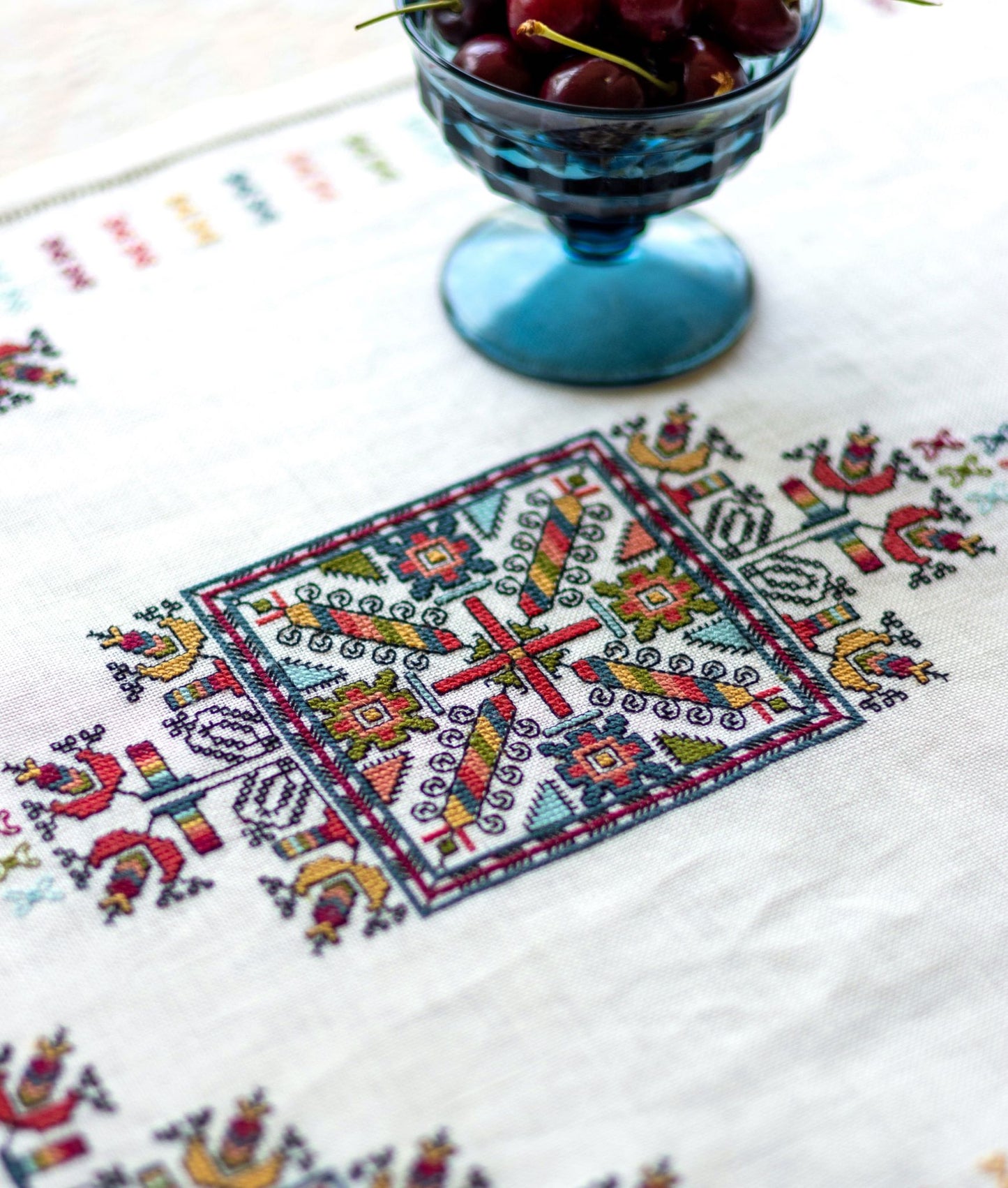 folk embroidery with geometric square design in multi colors