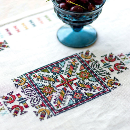 folk embroidery with geometric square design in multi colors