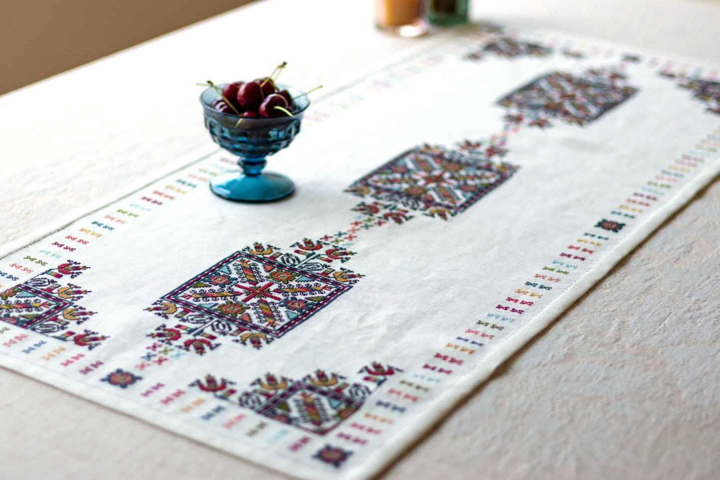 folk embroidery with geometric square design in multi colors