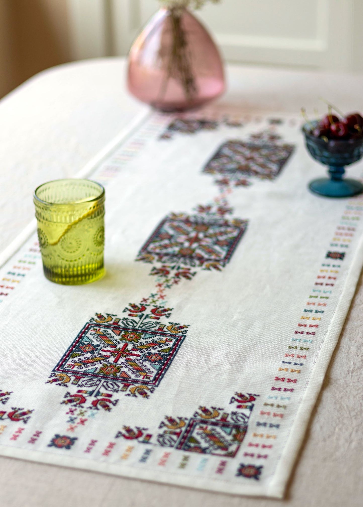 folk embroidery with geometric square design in multi colors