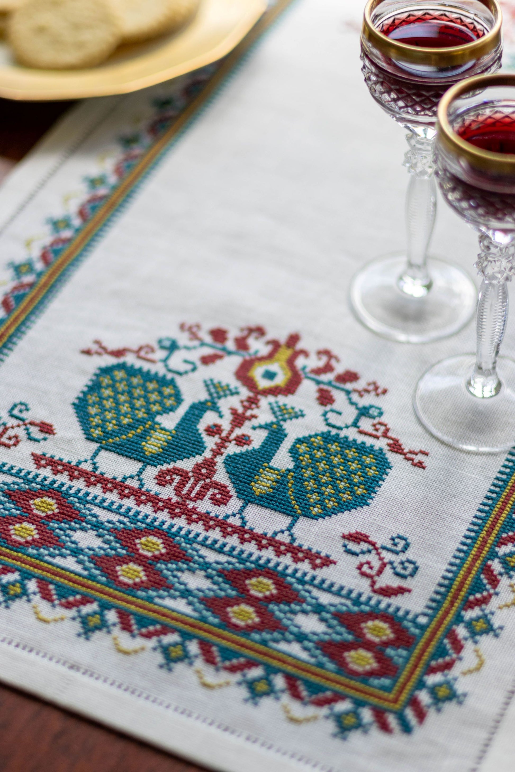 cross stitch folk embroidery table runner with peacocks