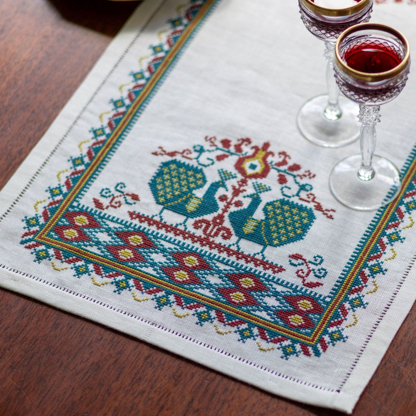 cross stitch folk embroidery table runner with peacocks
